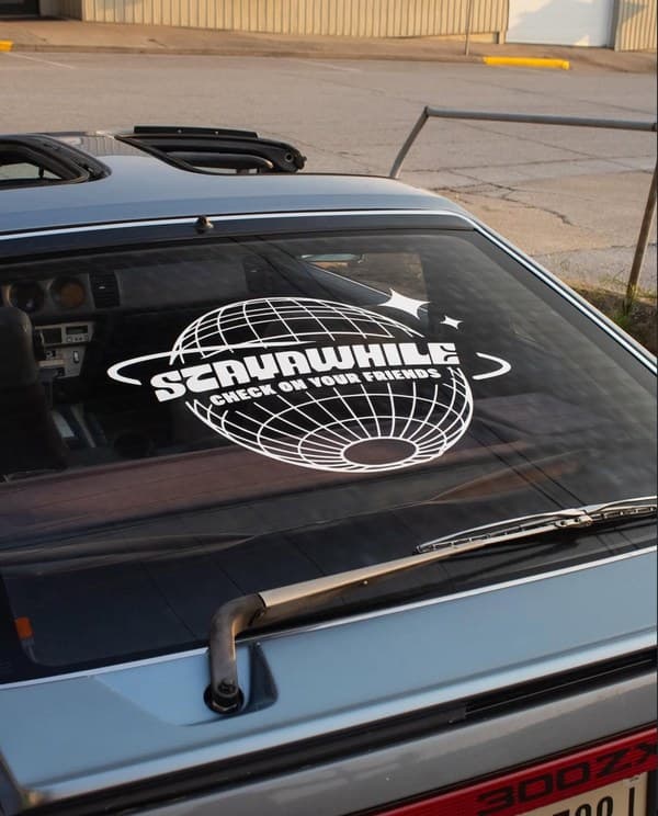 Stayawhile globe sticker on 300Z rear window